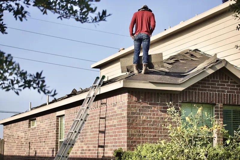 Professional roofer working on a residential roof in North Perris